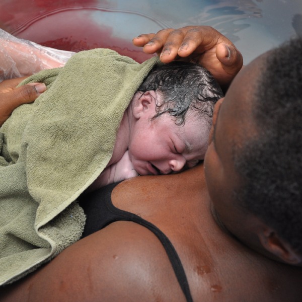 childbirth education mother holding newborn baby